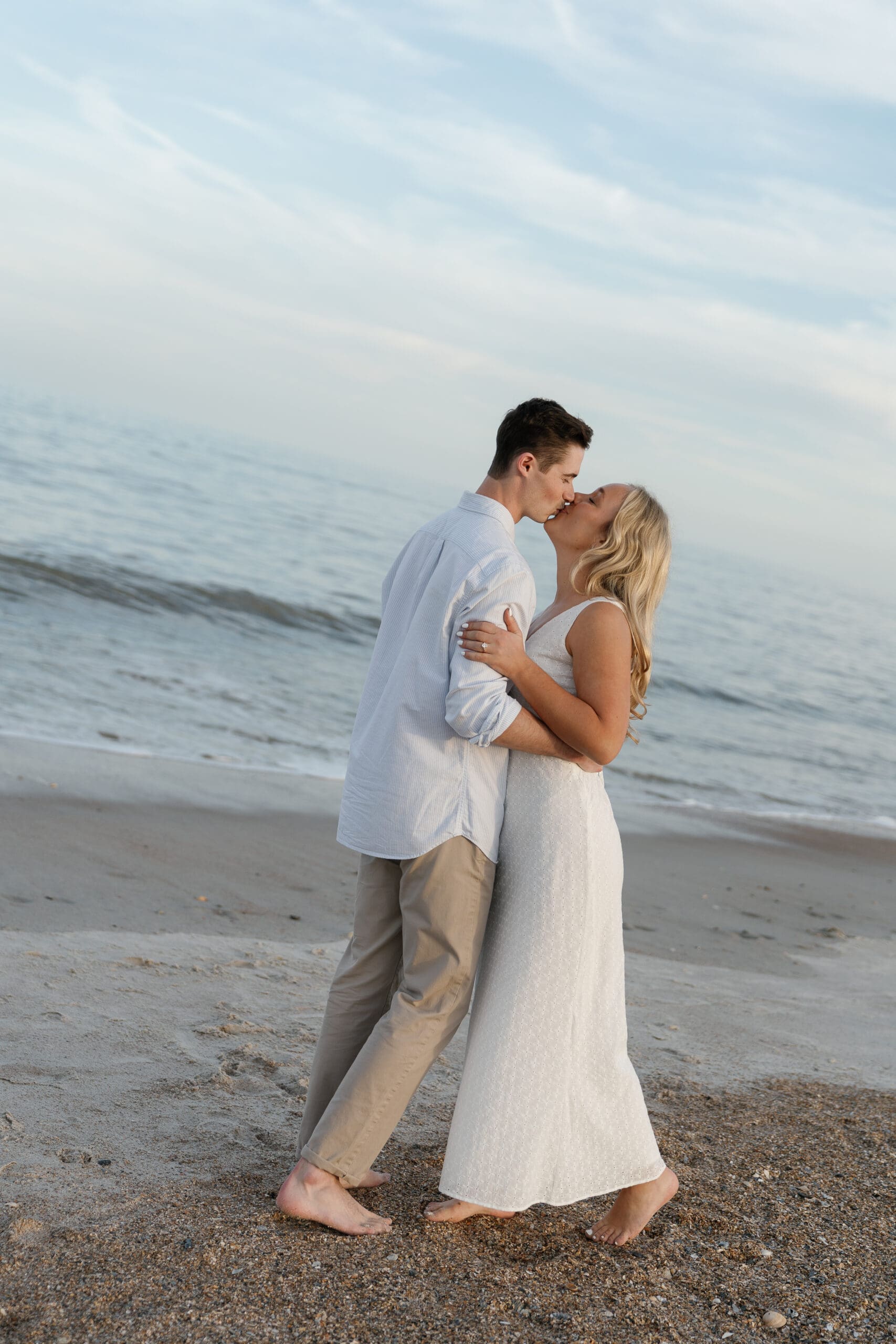 Couple kissing each other on Amelia Island beach