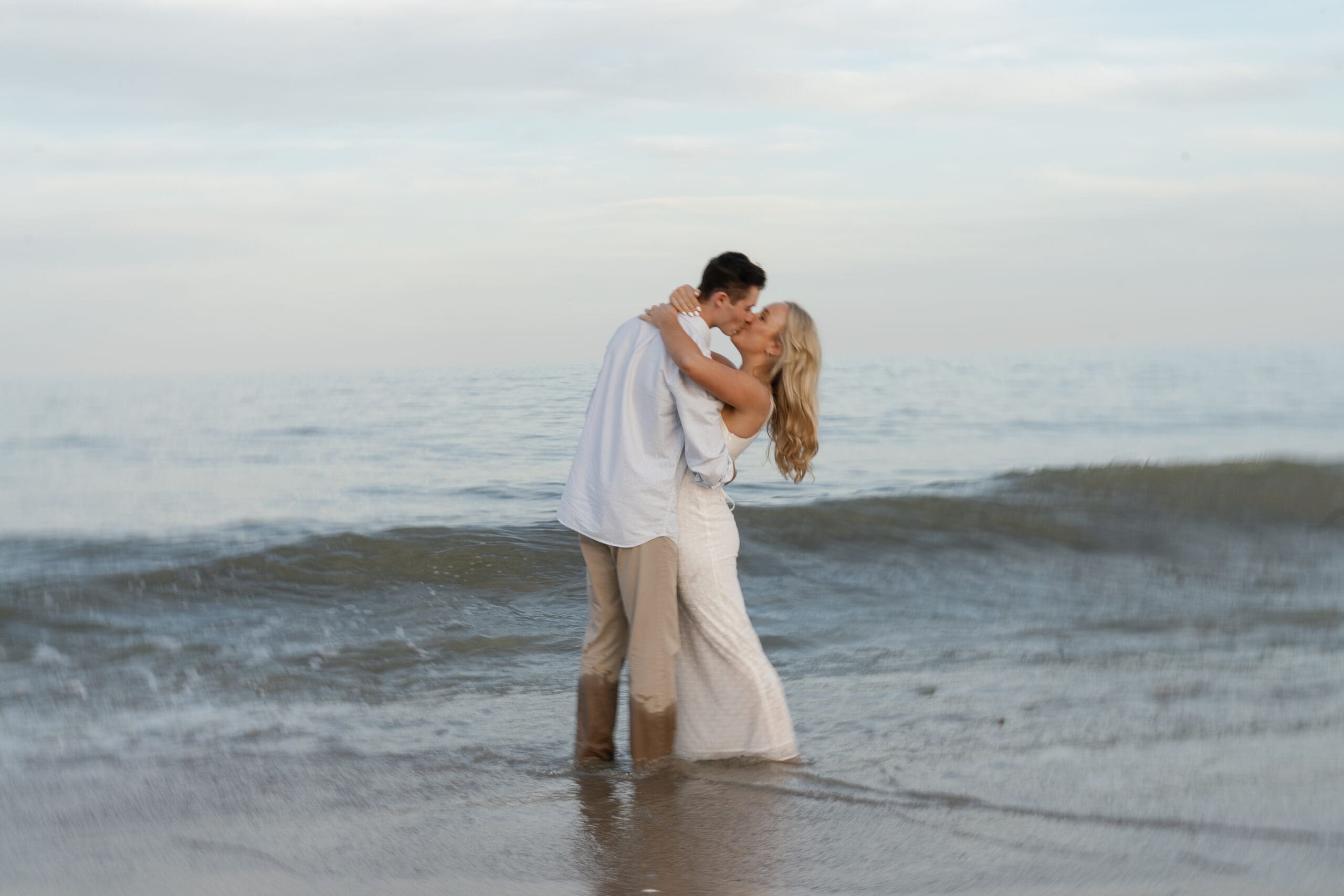 Couple kissing each other in the ocean