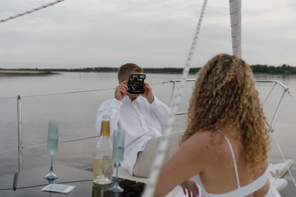 Guy taking photo of fiance during engagement session by Shelby Ann Photos