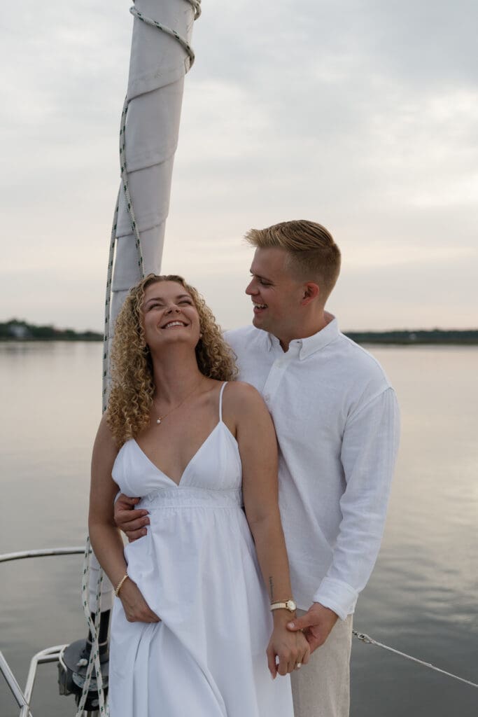 Couple posing and laughing during engagement photos